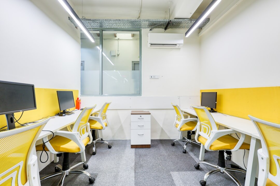 Modern newsroom office with editors working at desks