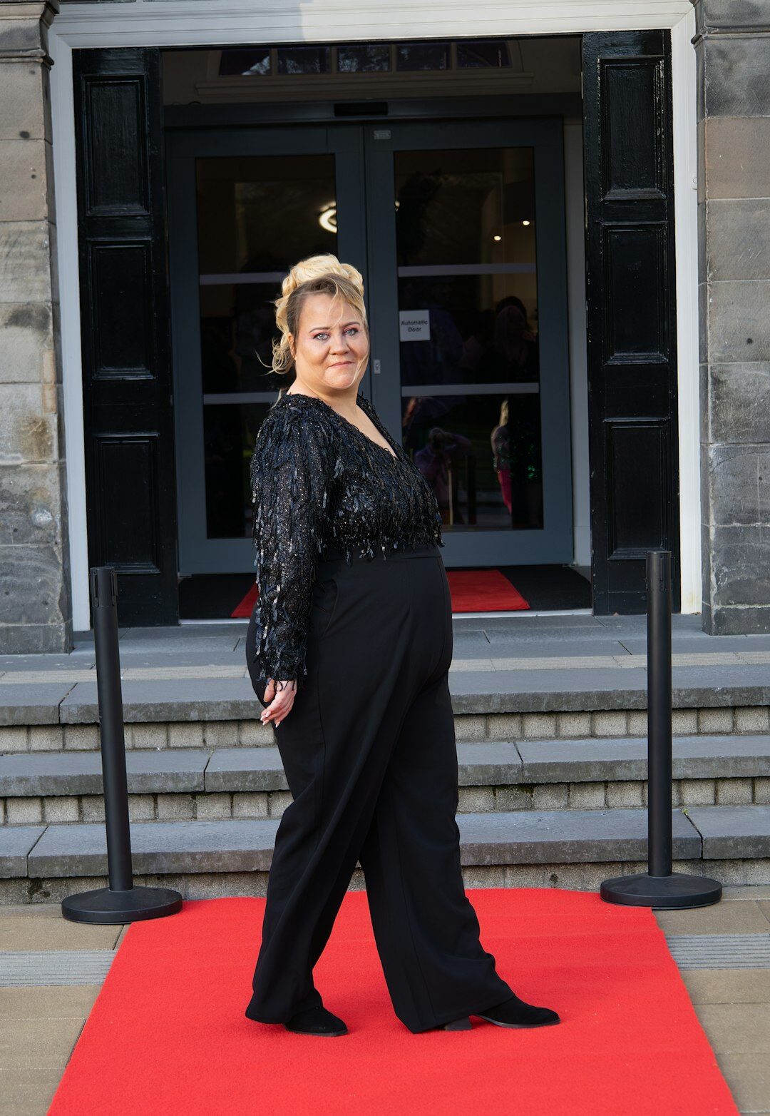 actor posing on red carpet