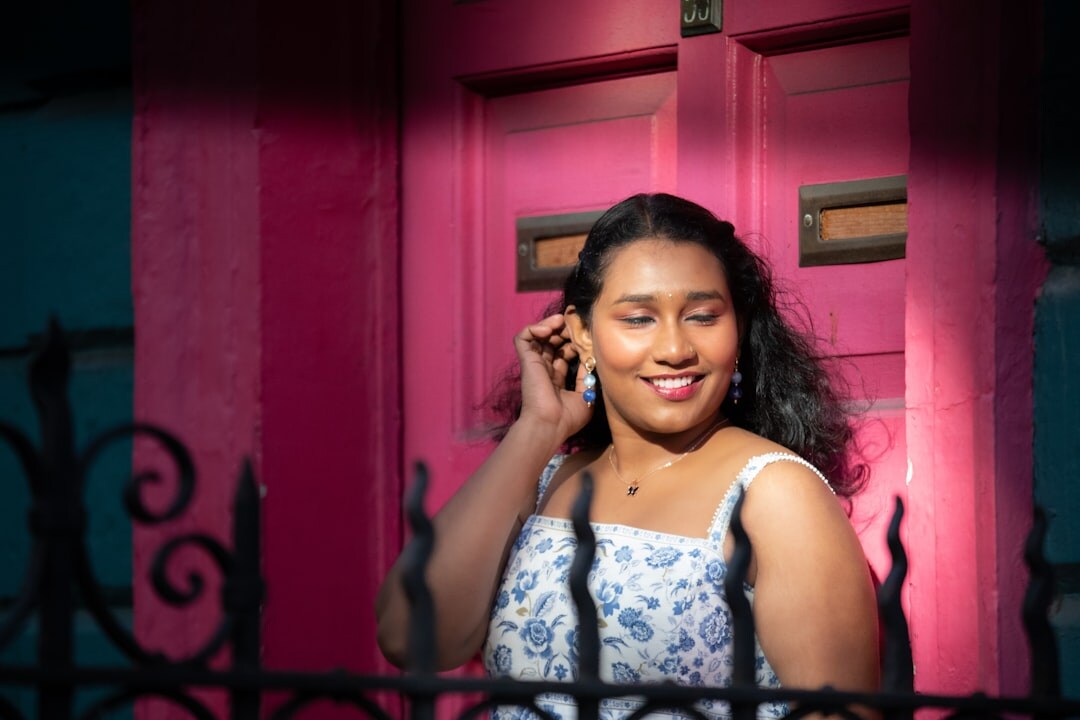 young woman smiling at phone